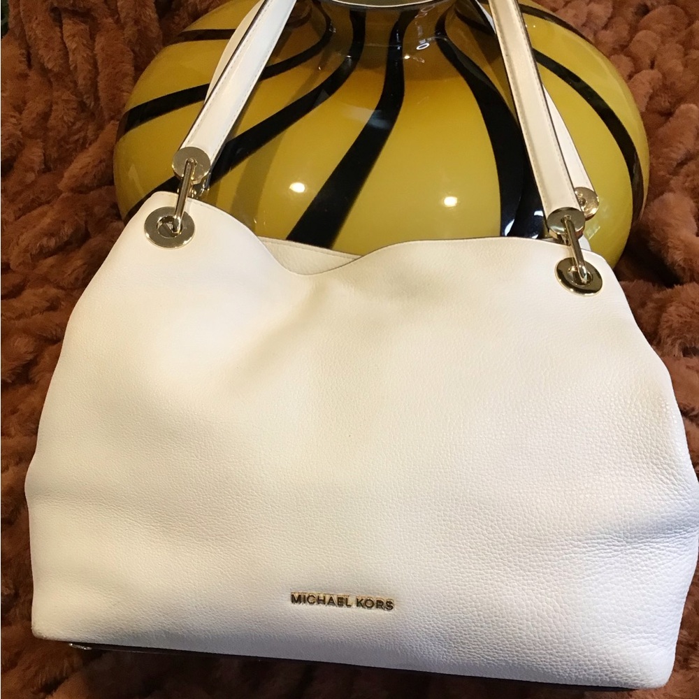 Michael Kors white multi-pocketed satchel purse.